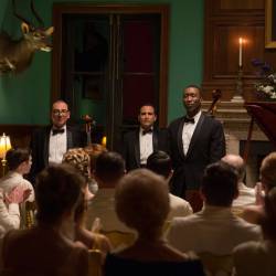 The Don Shirley Trio -- (from left), cellist Oleg (Dimiter D. Marinov), bassist George (Mike Hatton) and Dr. Donald Shirley (Mahershala Ali) -- following a performance in Green Book, directed by Peter Farrelly.